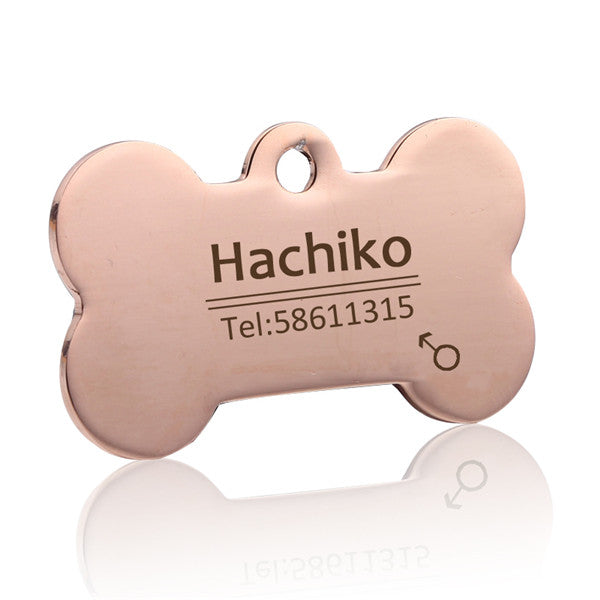 Rose gold bone-shaped pet ID tag with example engraving