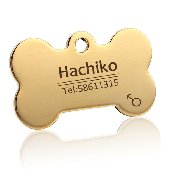 Gold bone-shaped pet ID tag with example engraving